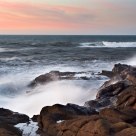 Surf and rocks at sunset